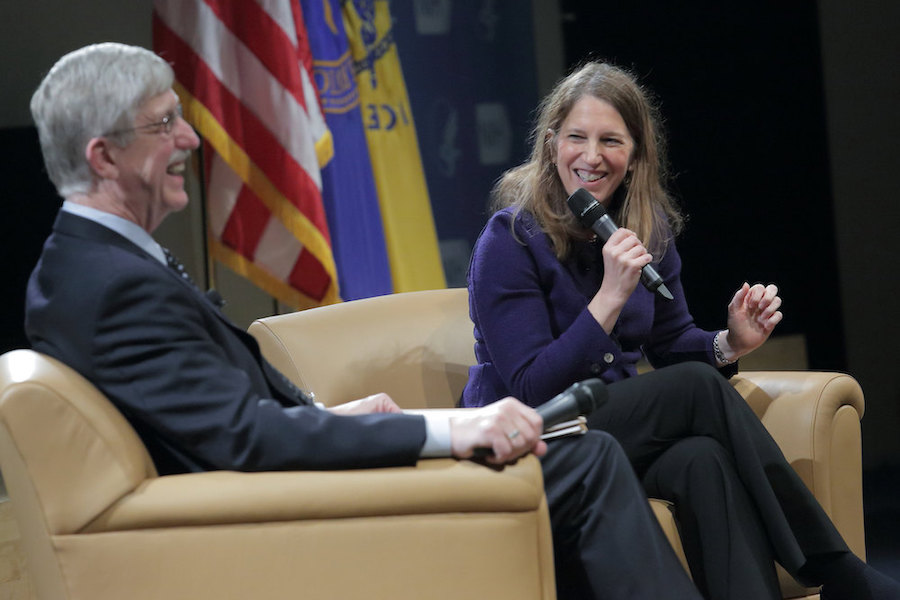 Dr. Francis Collins sitting with Secretary Sylvia Burwell on stage